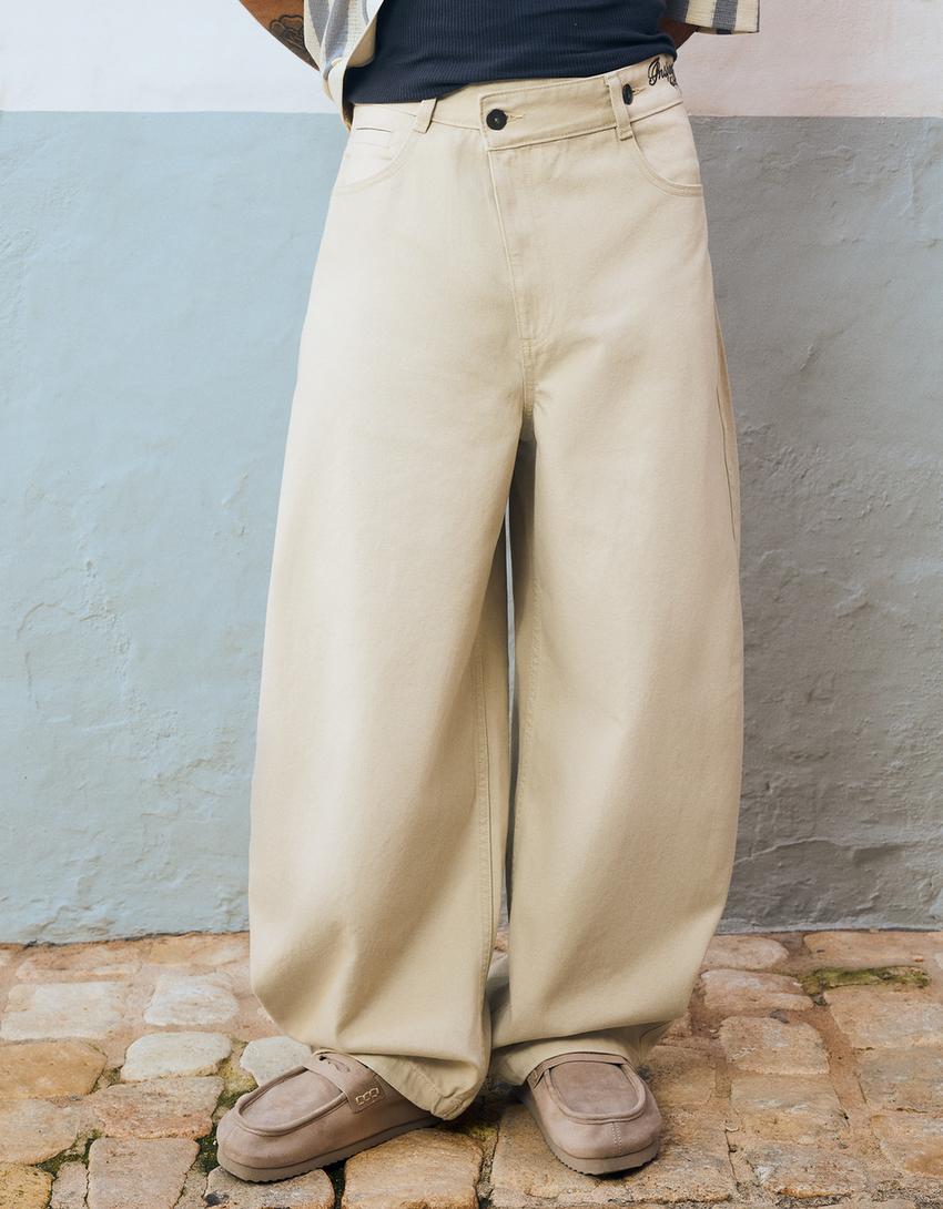 Embroidered crossover barrel-leg trousers-Sand