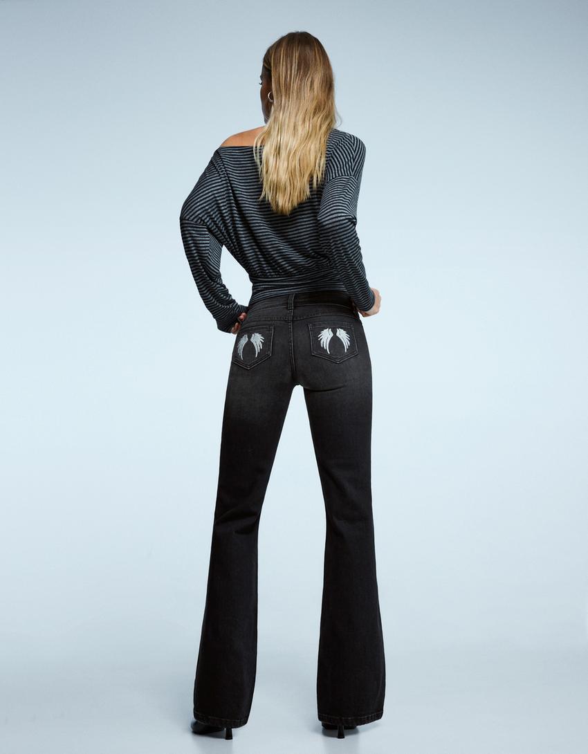 Flared jeans with embroidered pockets-Black