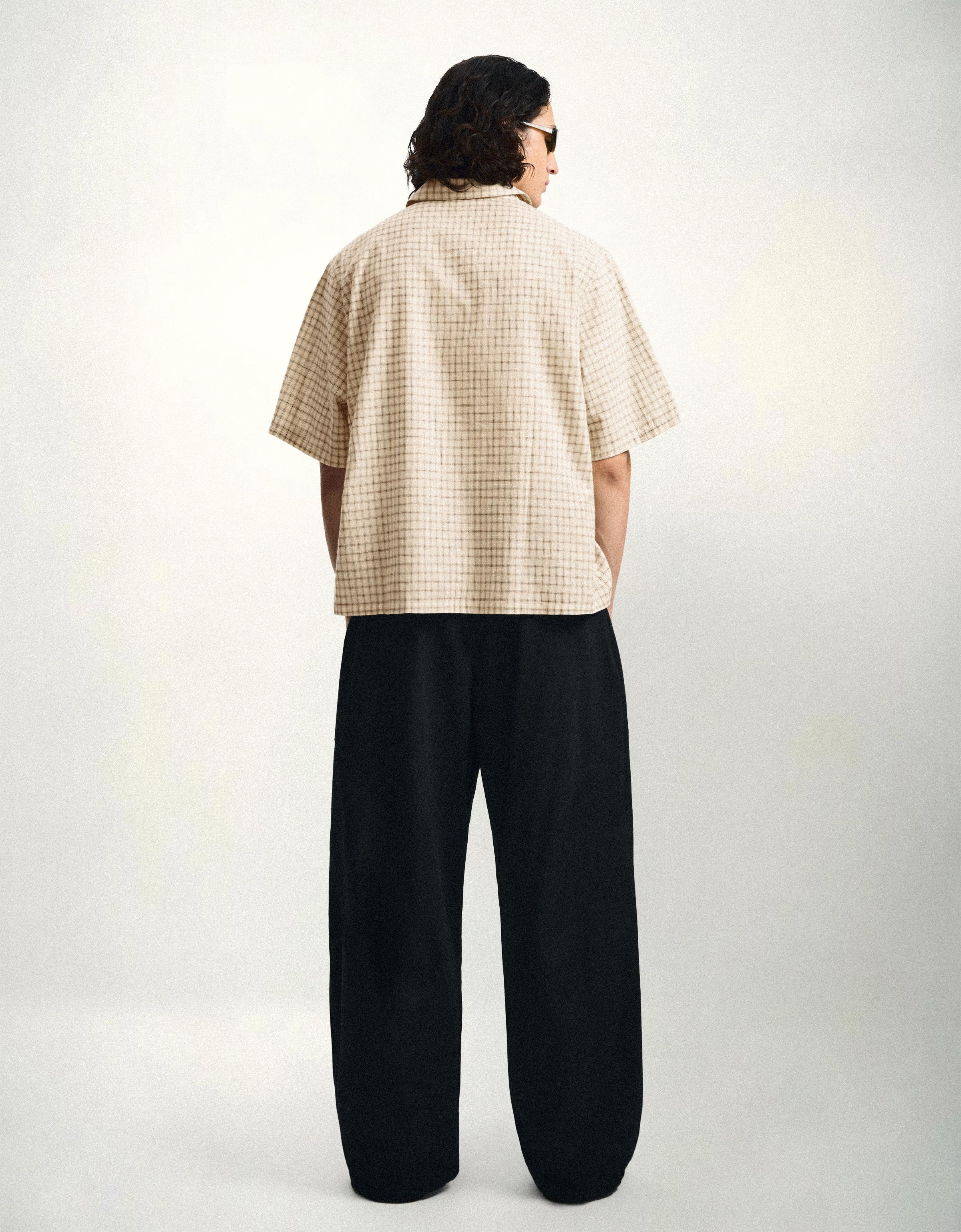 Darted barrel leg trousers — Black