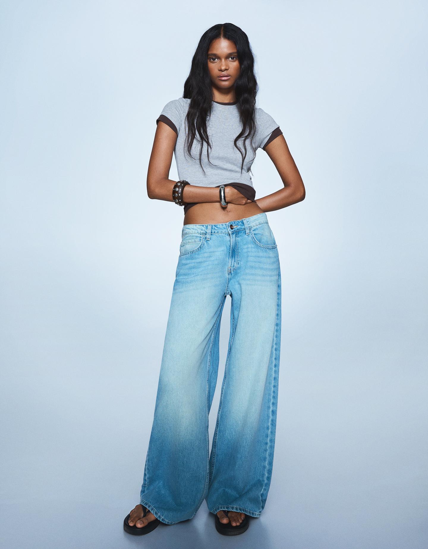 Bershka jeansy o kroju wide leg wyblakły niebieski