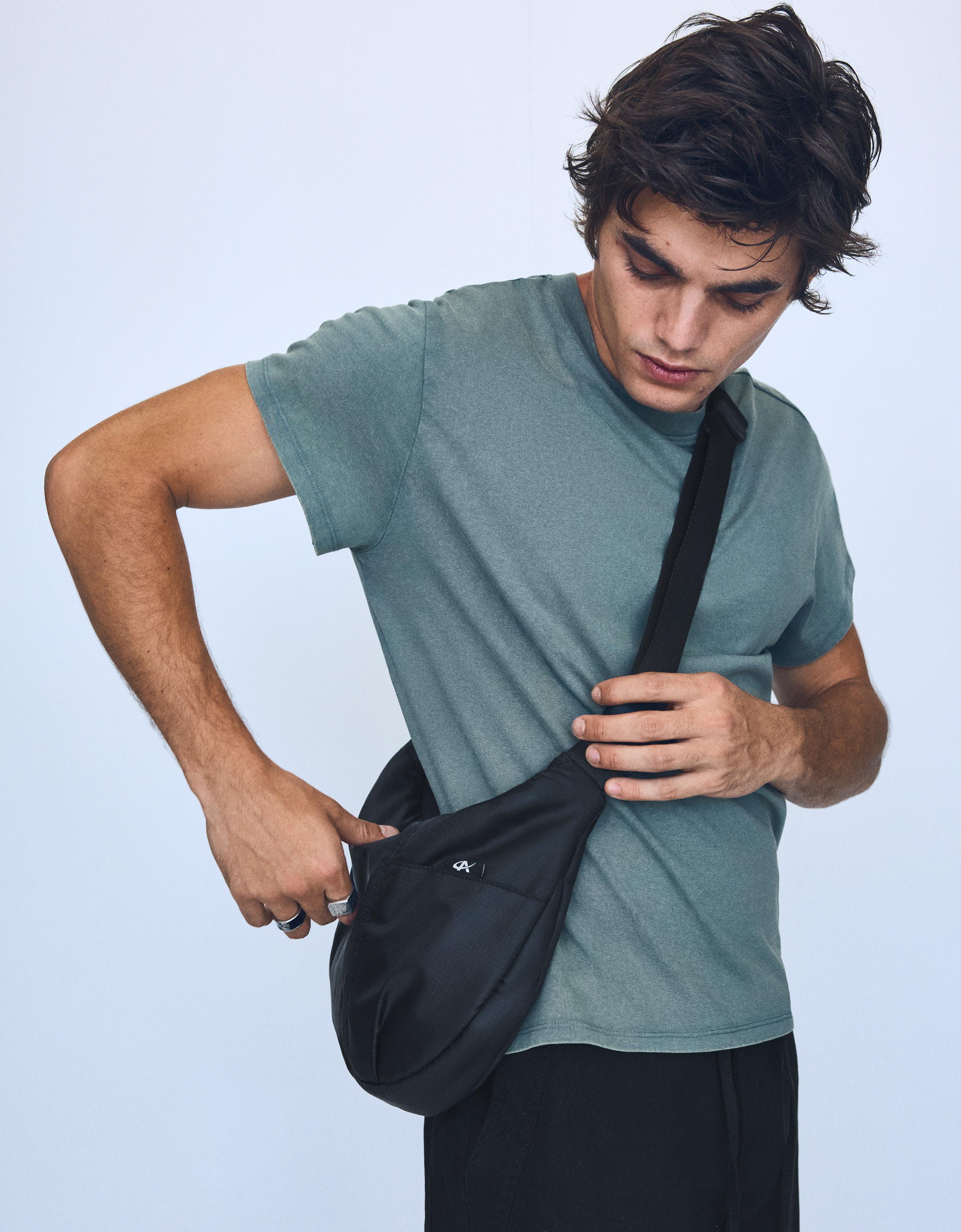 Technical multi-pocket bucket bag — Black