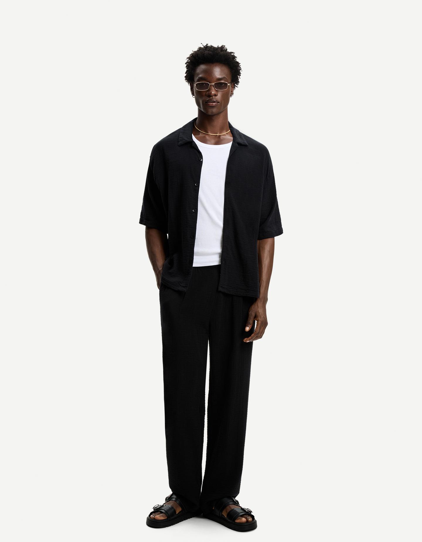 Bershka spodnie o kroju wide leg z krepy czarny