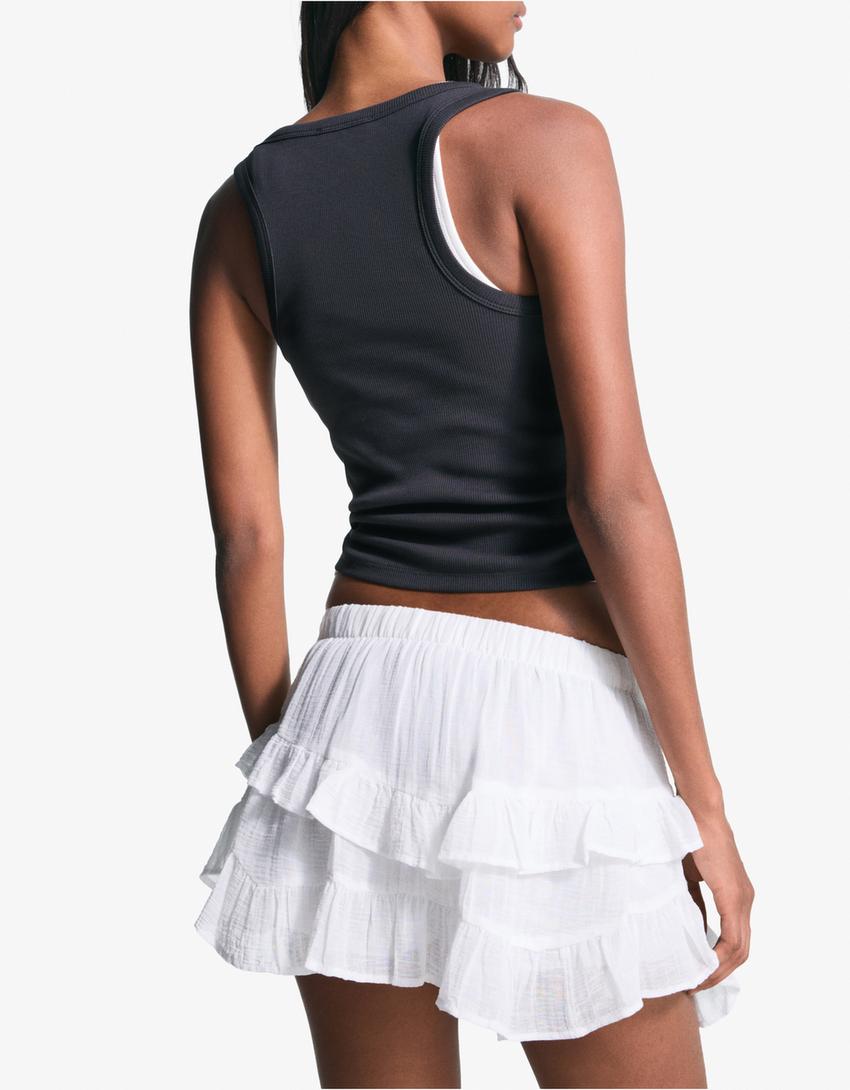 Ruffled mini skirt with studs-White