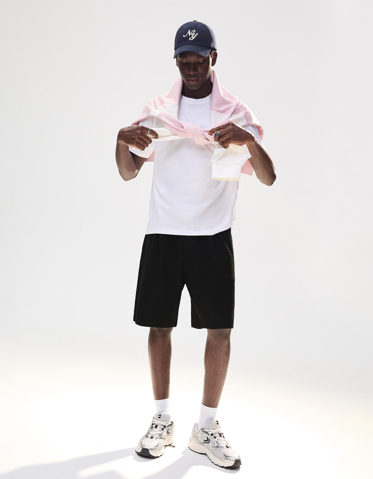 Textured plush Bermuda shorts — Black