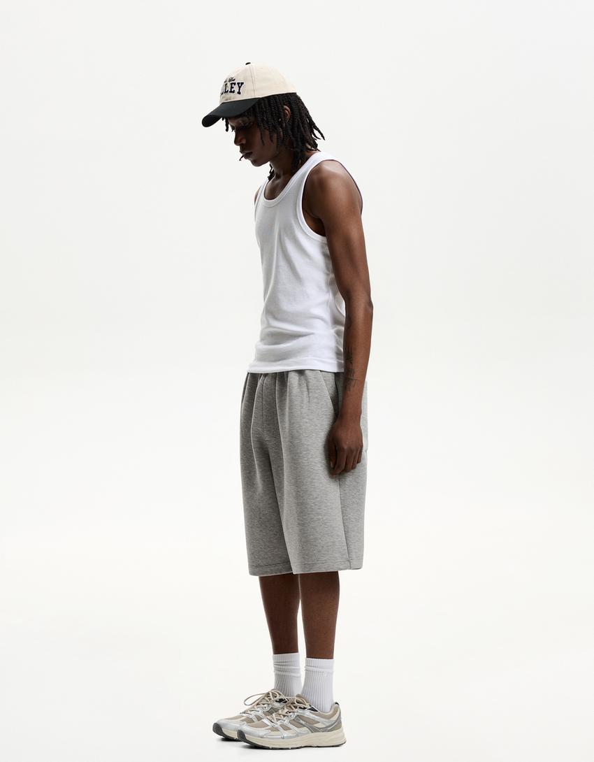 Oversize neoprene-effect Bermuda shorts