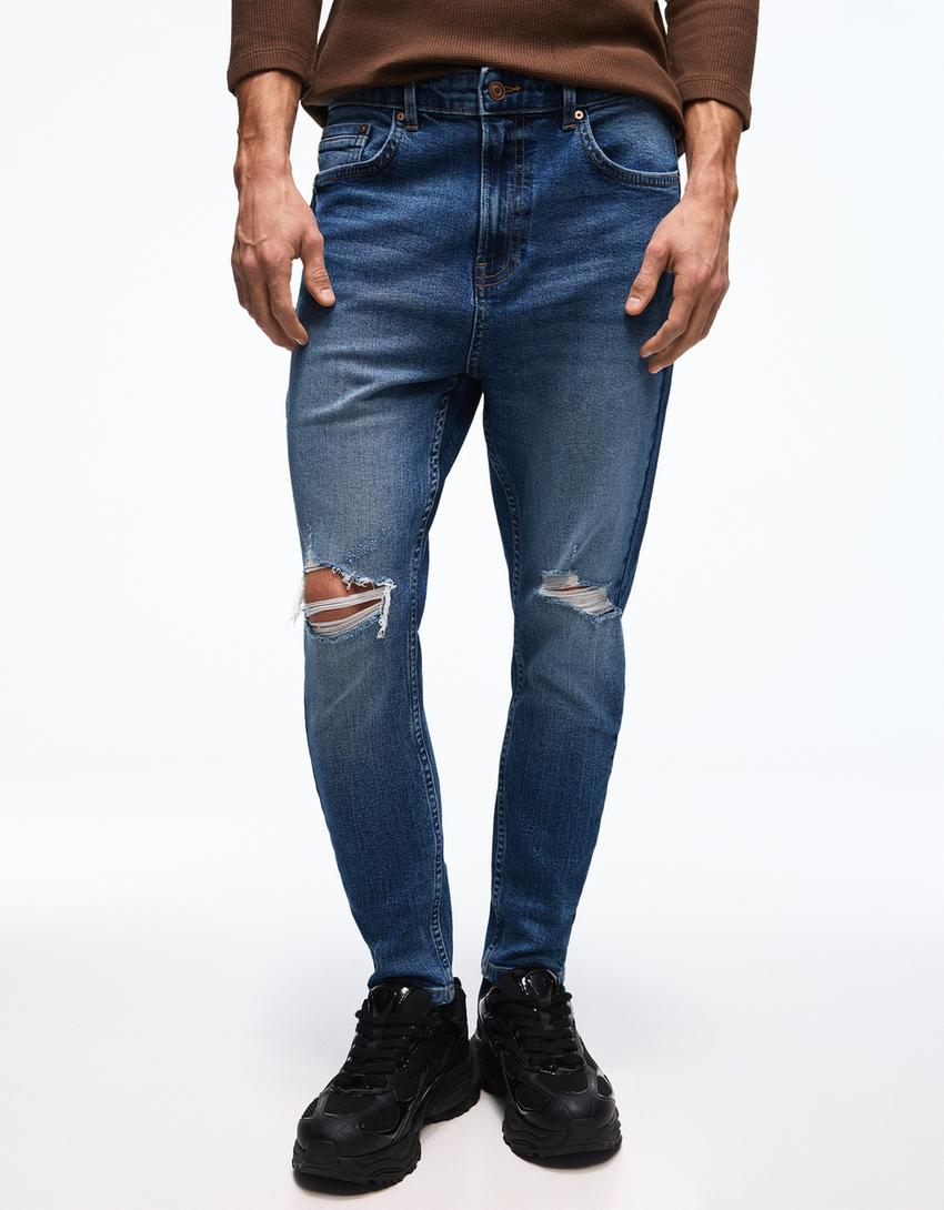 Carrot fit jeans met scheuren-Blauw