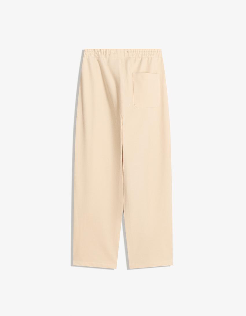 Pantaloni balloon fit jogger con borchie-Avorio