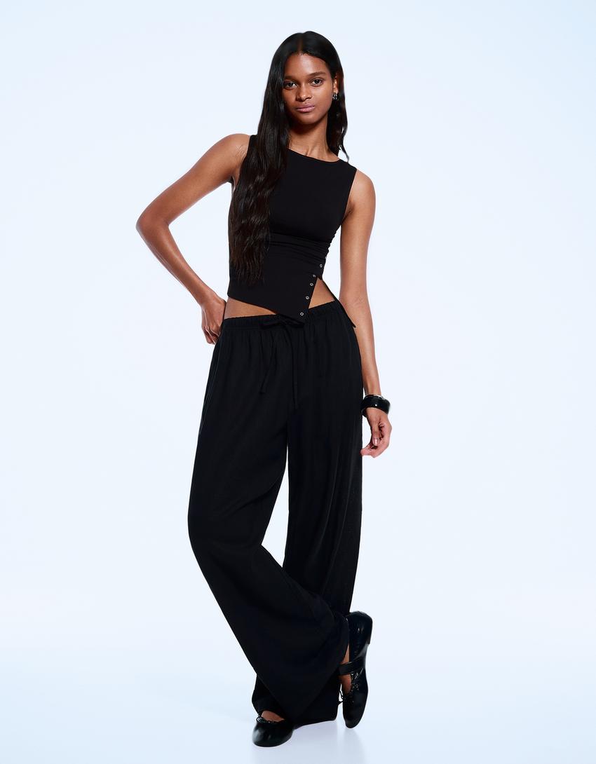 Asymmetrisch mouwloos T-shirt met studs-Zwart