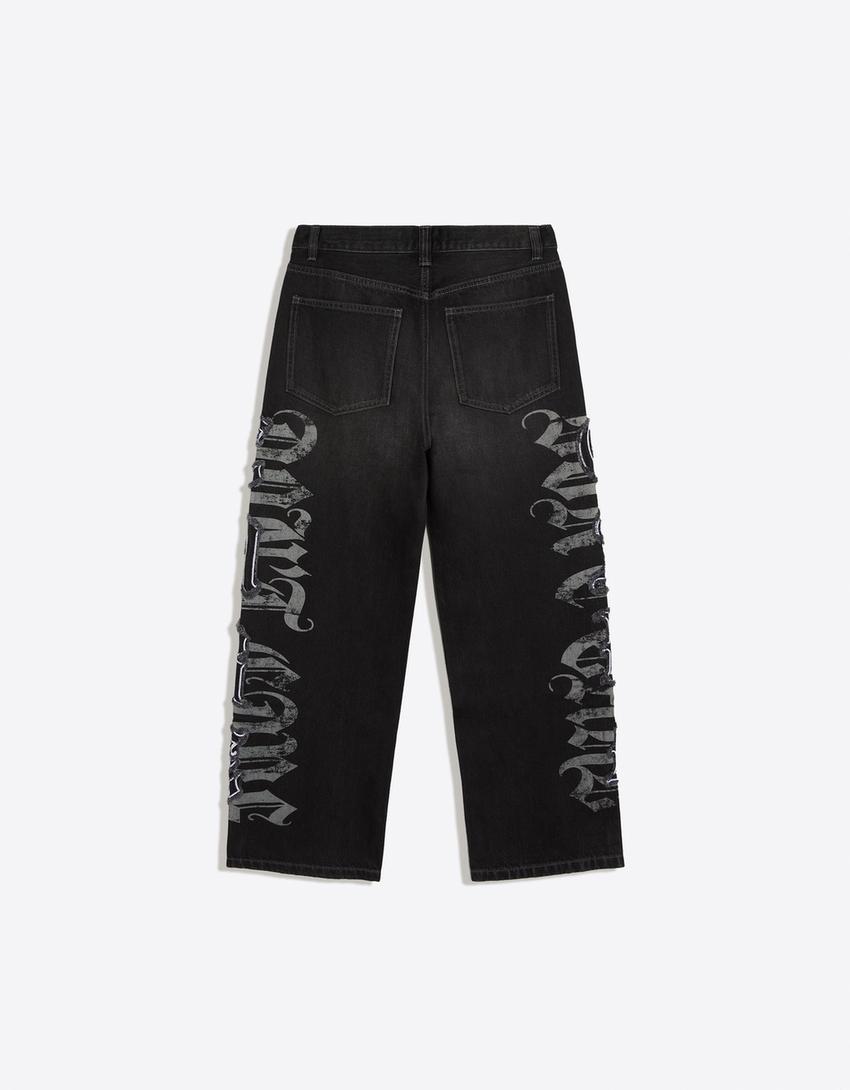 Jeansy o kroju baggy z naszywkami w gwiazdy-Czarny
