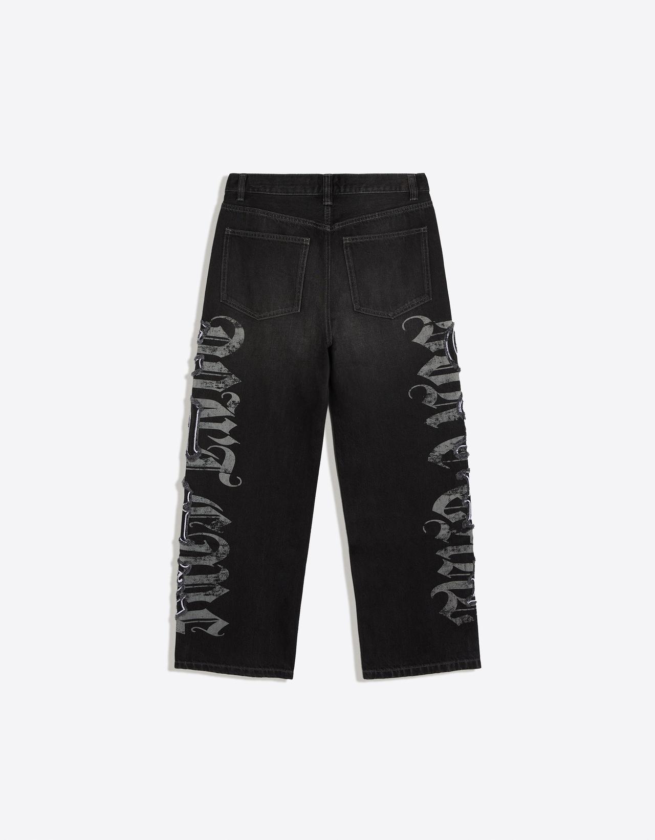 Baggy jeans with star patches — Black