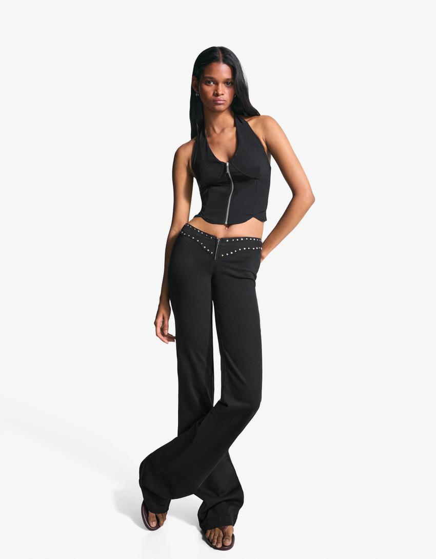Pantaloni con borchie in vita e cerniera-Nero-1