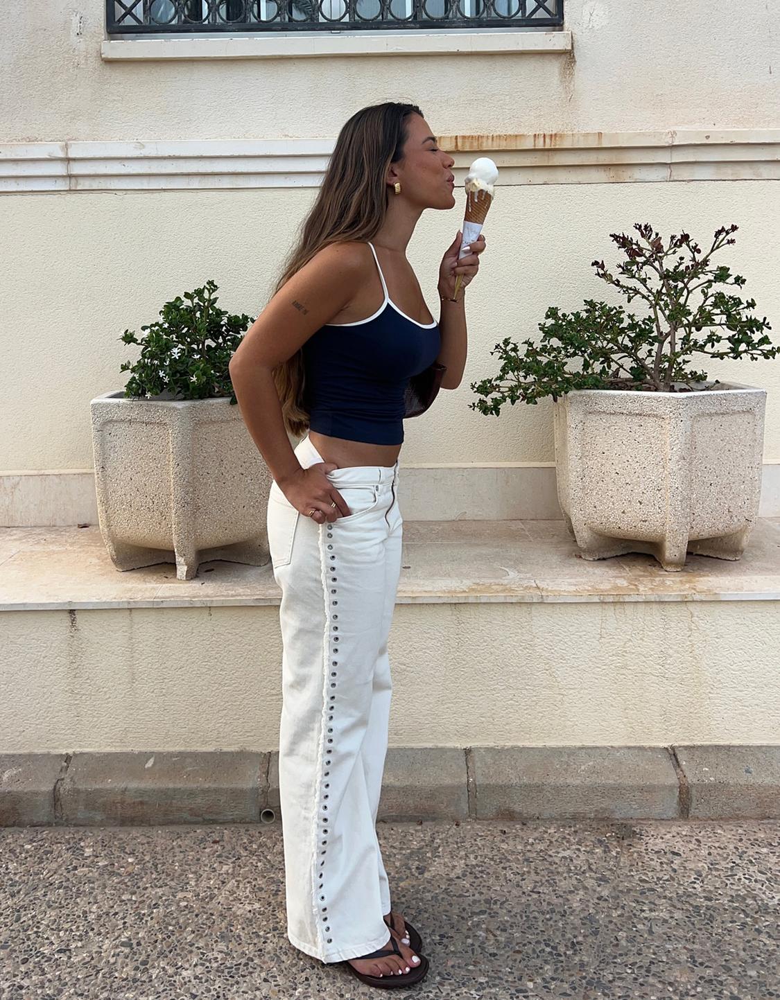 Frayed straight-leg trousers with eyelets