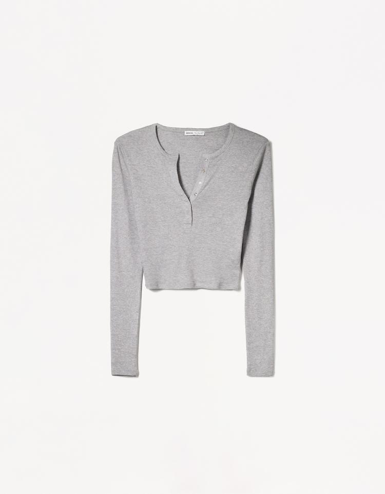 Long sleeved button neck top