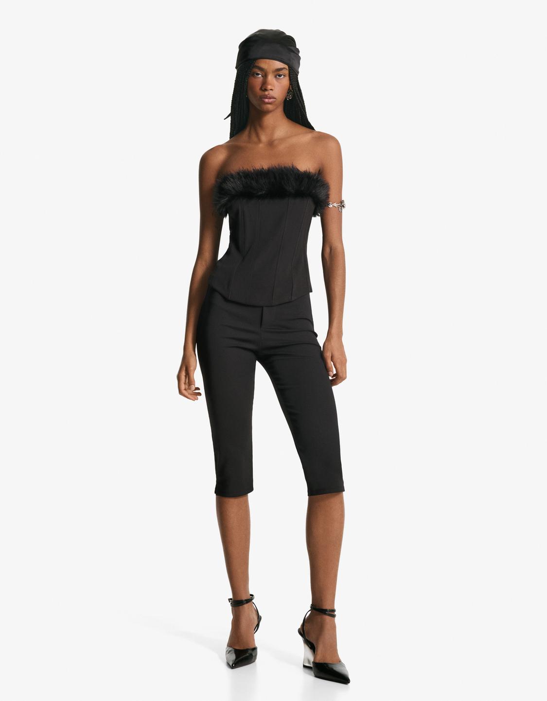 Corsetry-inspired bandeau top with faux fur neckline