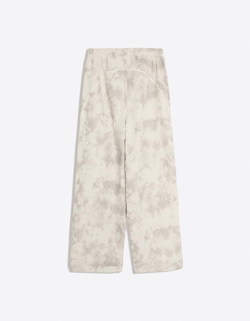 Technical print parachute trousers-Stone