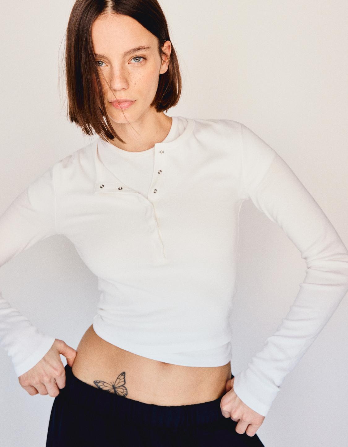 Long sleeved button neck top