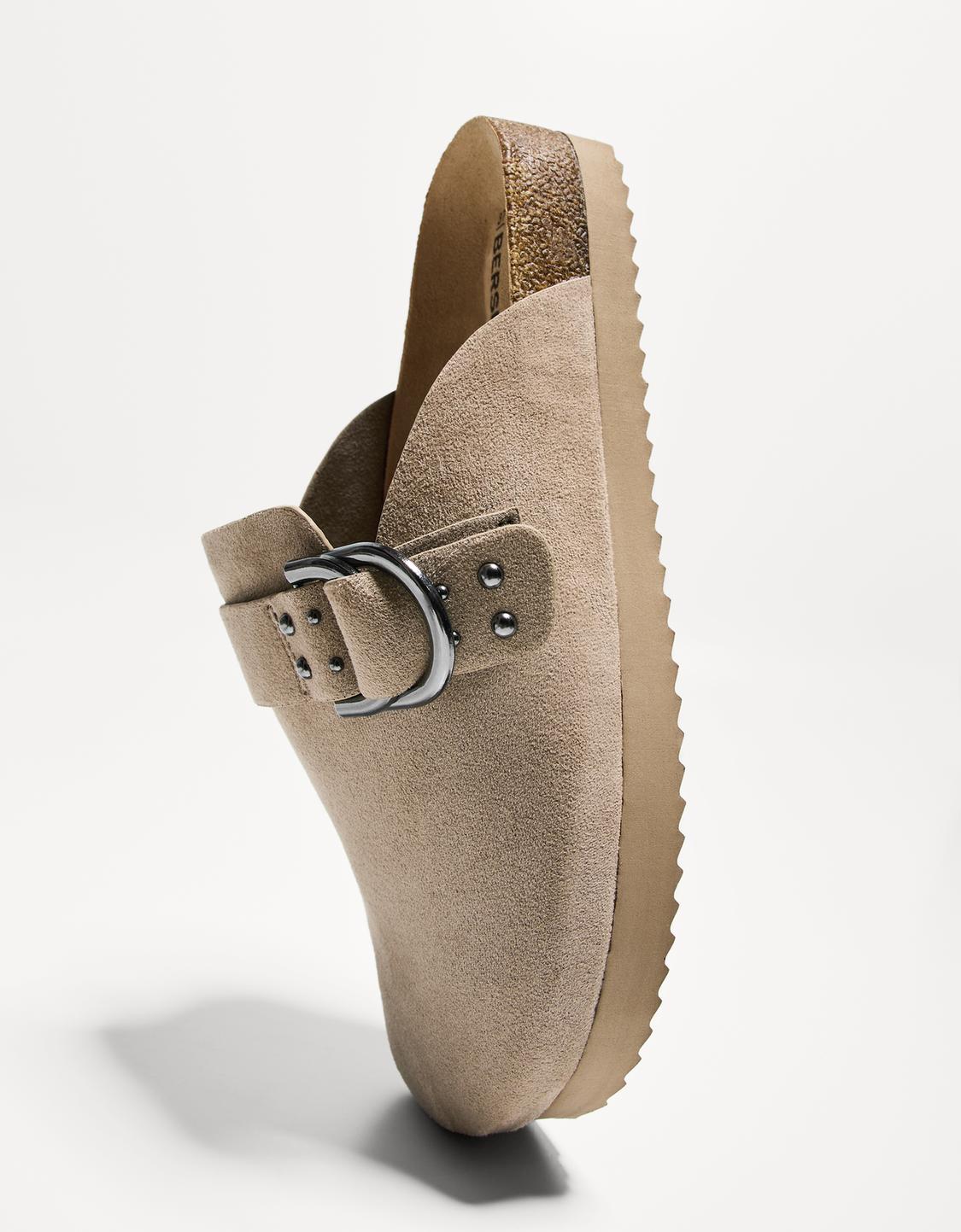 Buckled clogs with stud details