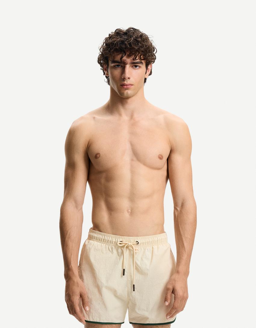 Short swimming trunks with trim-Sand