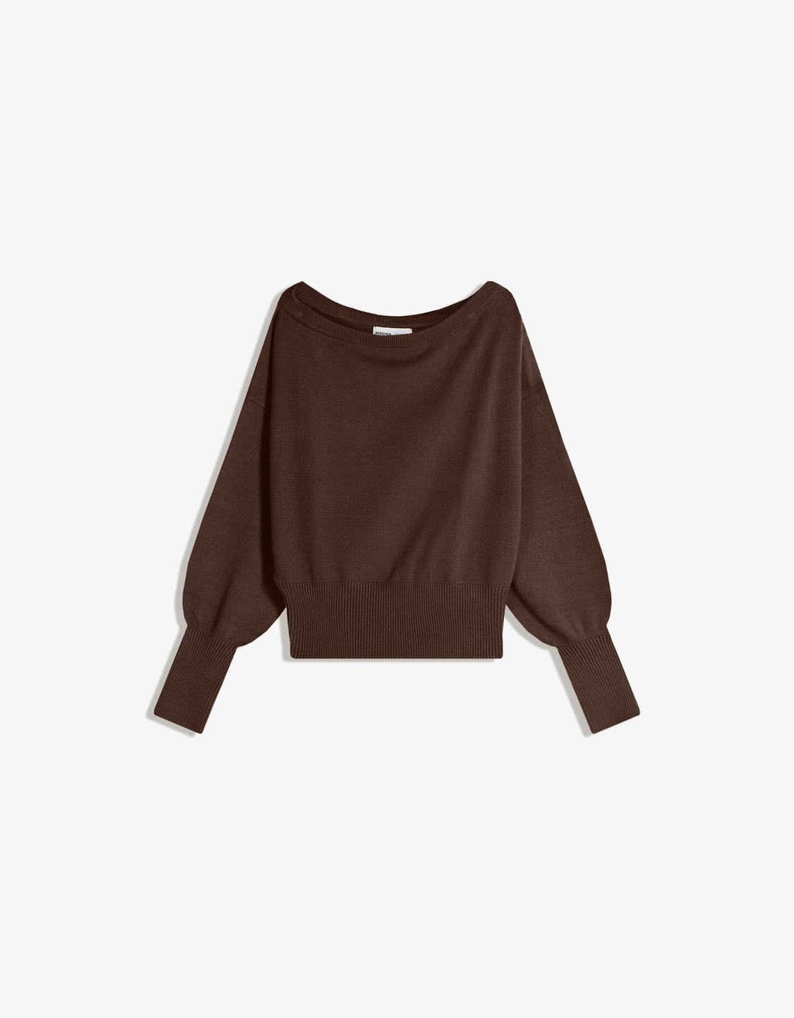Asymmetric sweater with ribbed hem