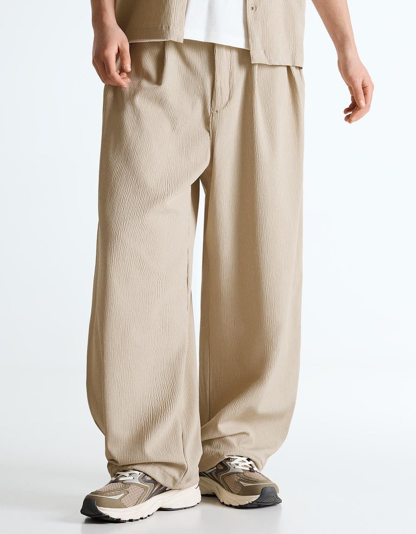 Plisowane spodnie o kroju superbaggy semijogger-Piaskowy