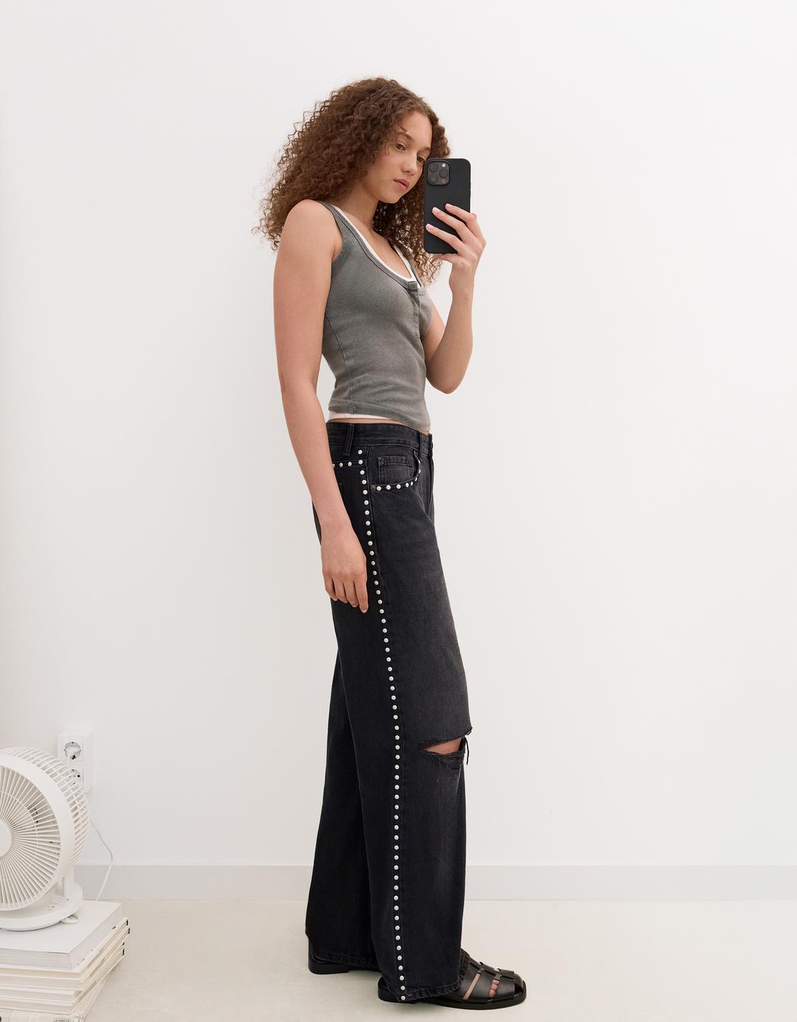 Ripped wide-leg jeans with studs