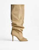 Stiletto heel boots with slits
