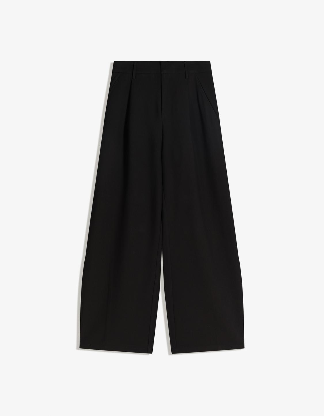 Voluminous trousers with double fabric