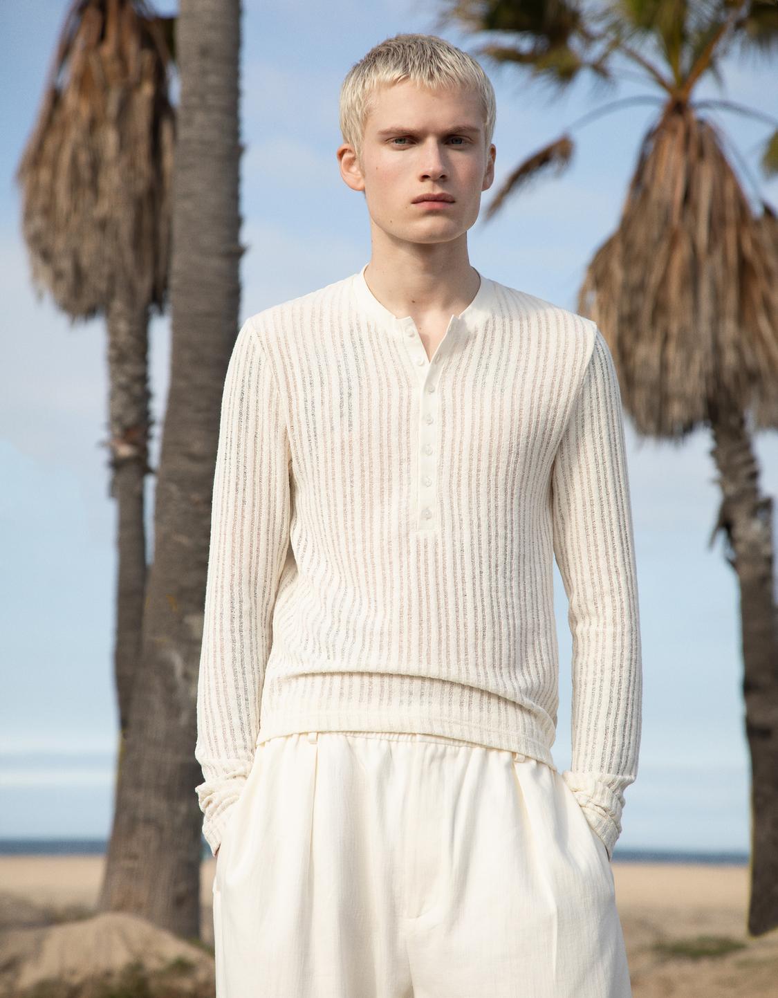 Openwork sweater with buttons