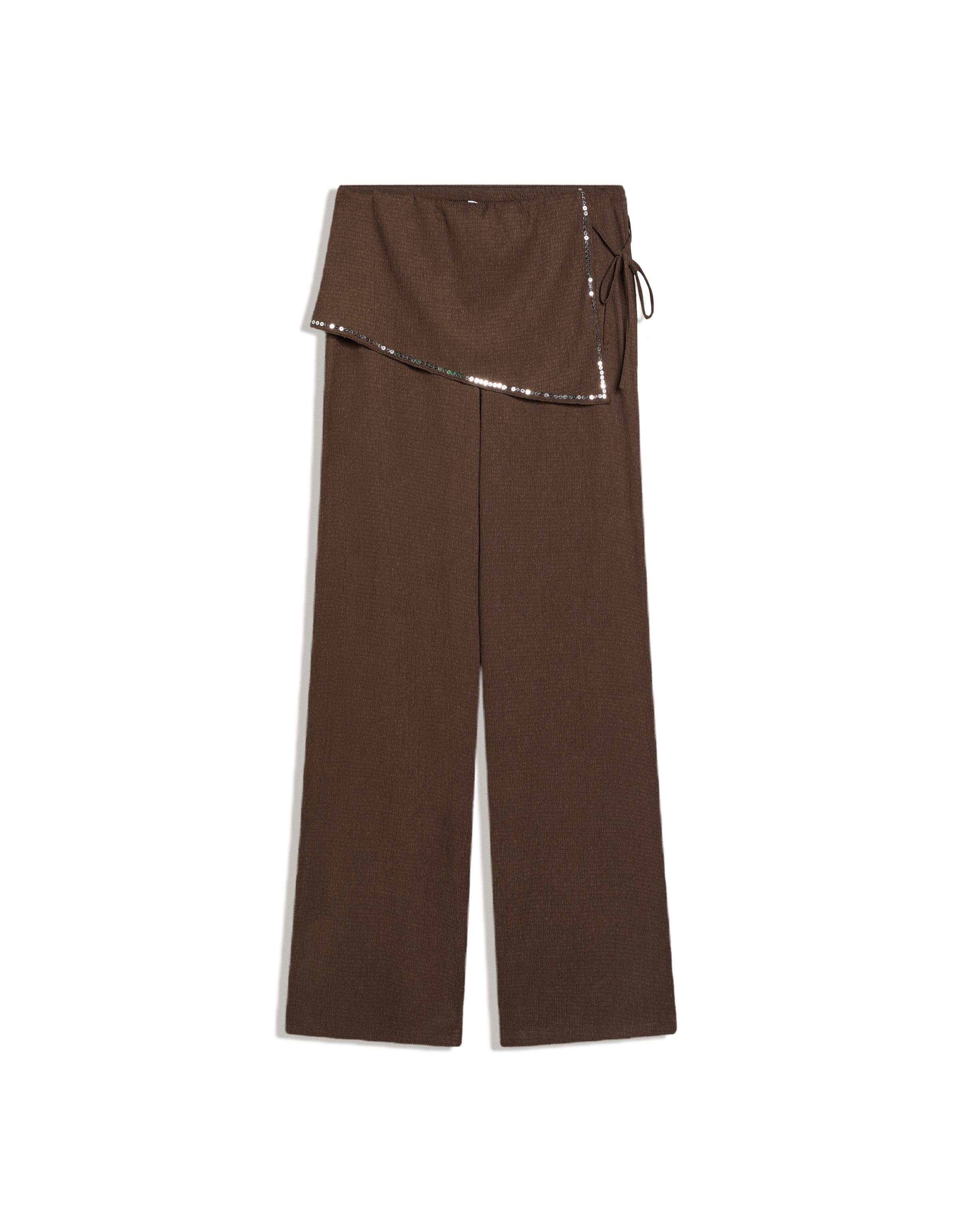 Trousers with sequin overskirt