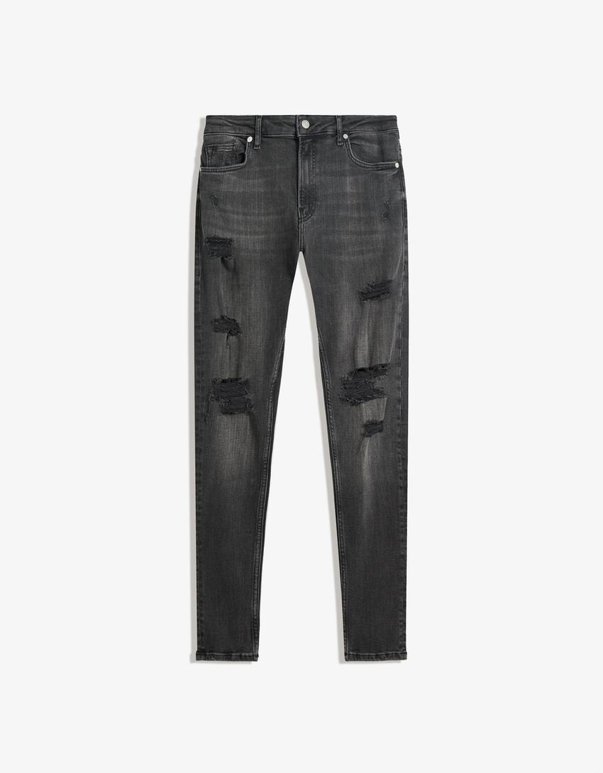 Jeans super skinny strappati-Nero