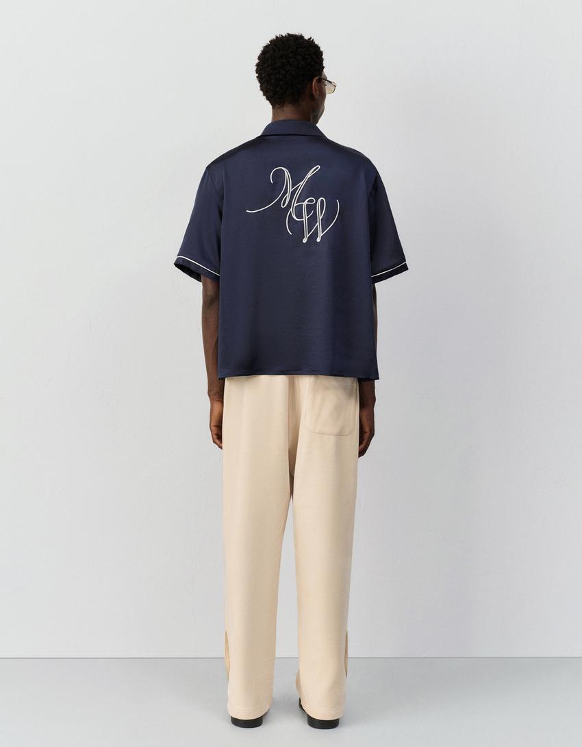 Pantaloni balloon fit jogger con borchie-Avorio