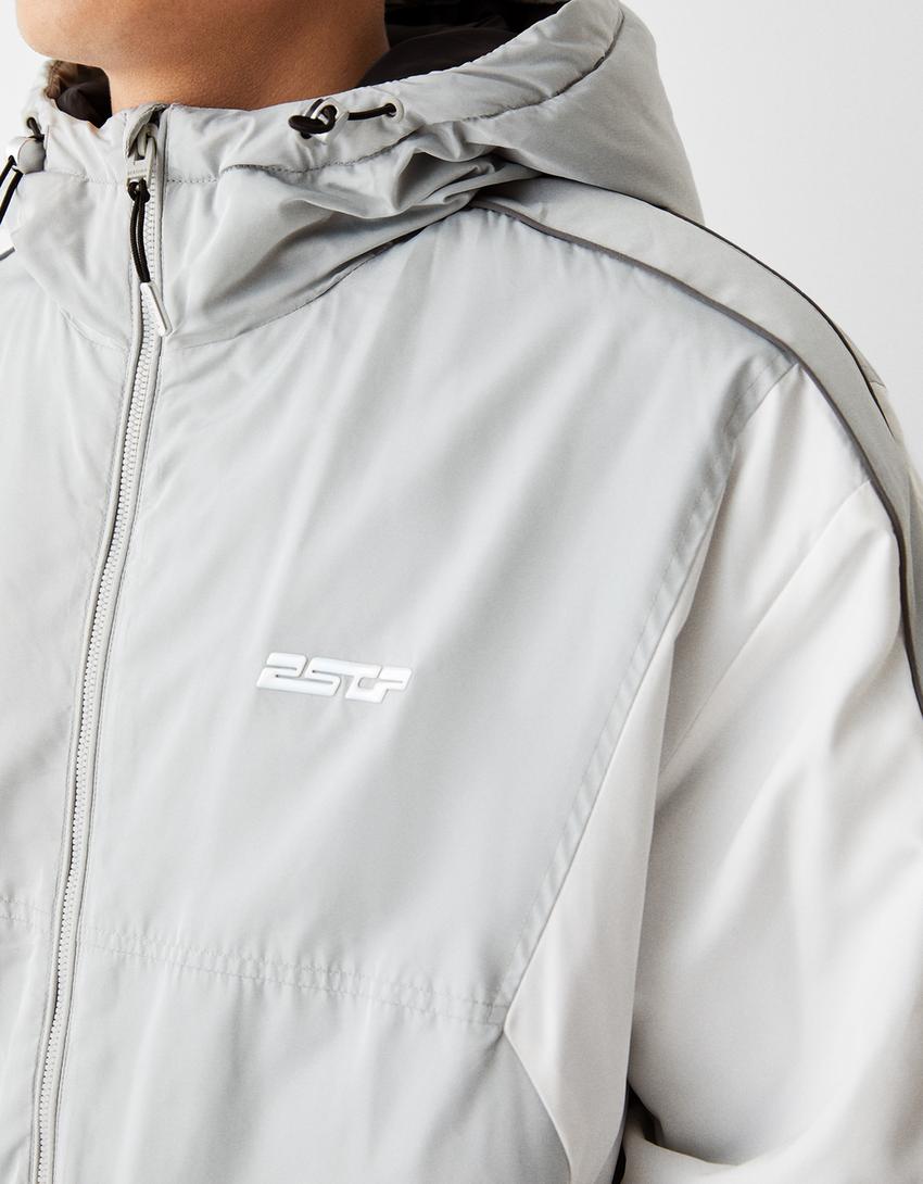 جاكيت تقني بكتل لونية وغطاء رأس-رمادي-6