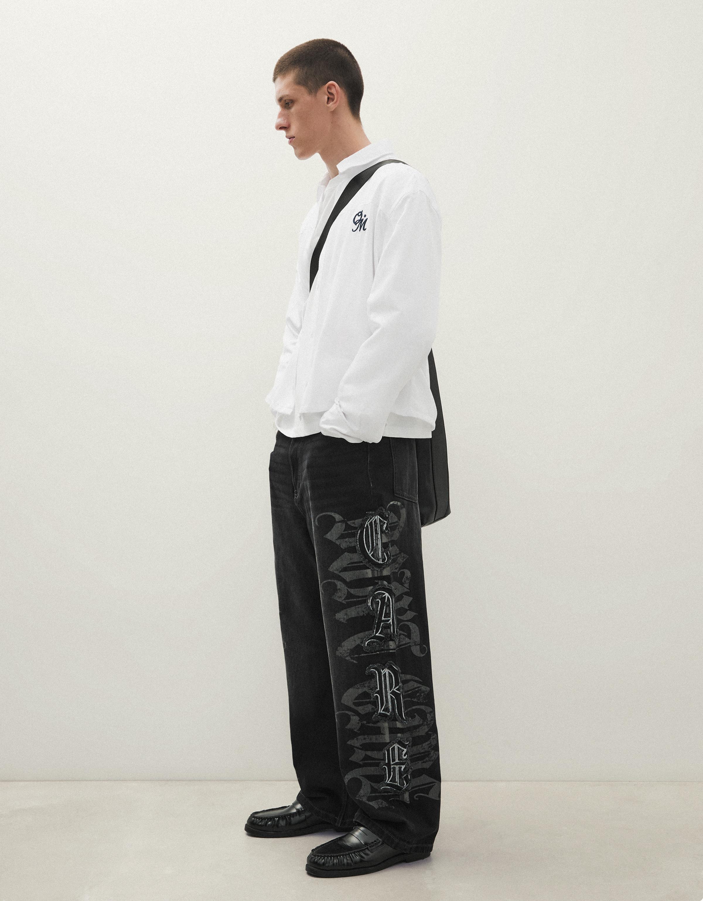 Baggy jeans with star patches — Black