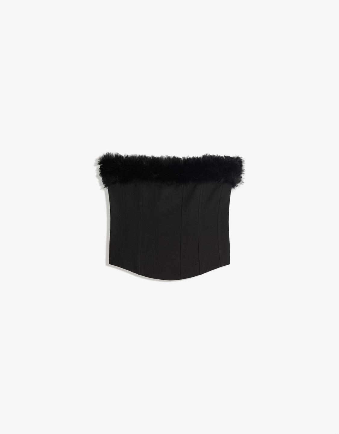 Corsetry-inspired bandeau top with faux fur neckline
