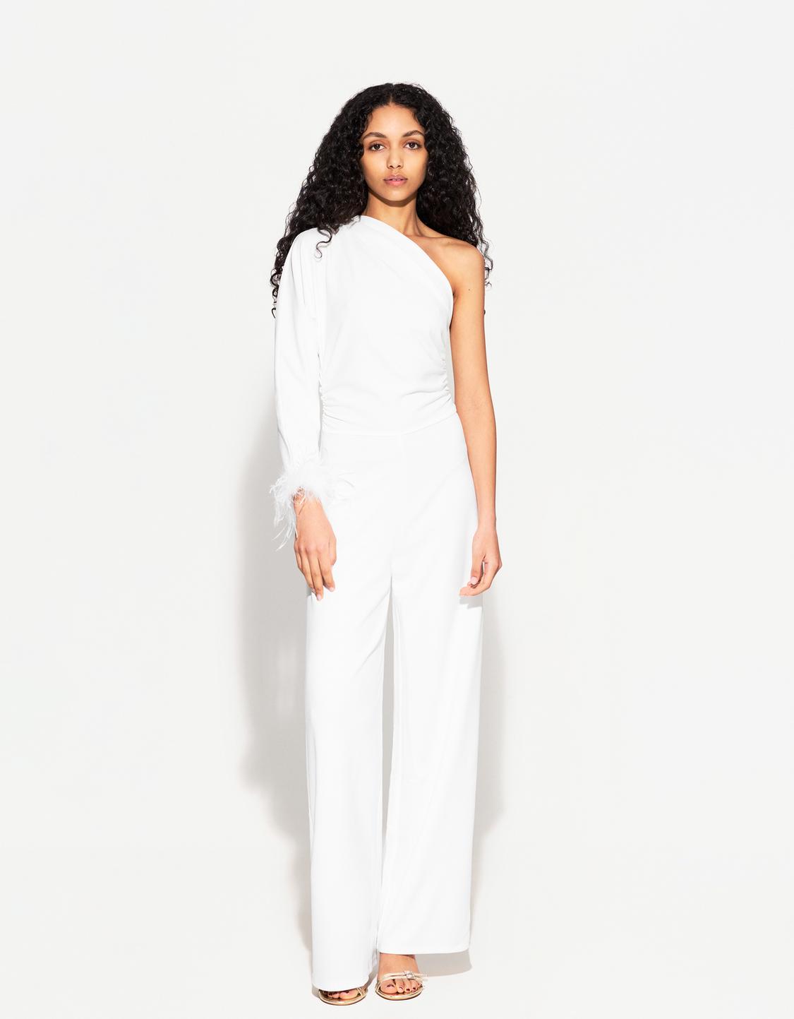 Asymmetric jumpsuit with feathers