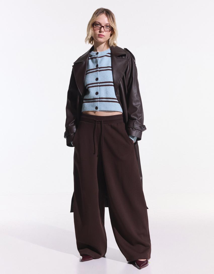 Marra eta botoiak dituen kardigana-Turkesa