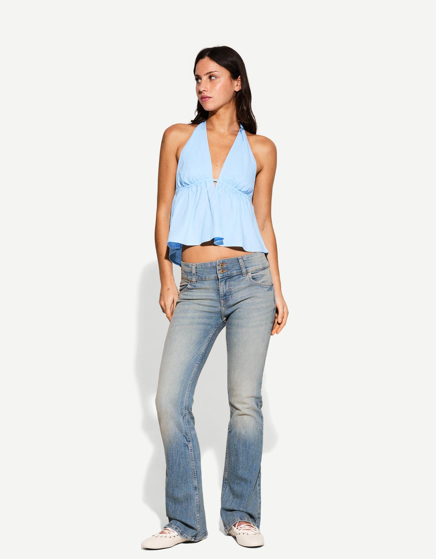 Bershka jeansy bootcut low waist wyblakły niebieski