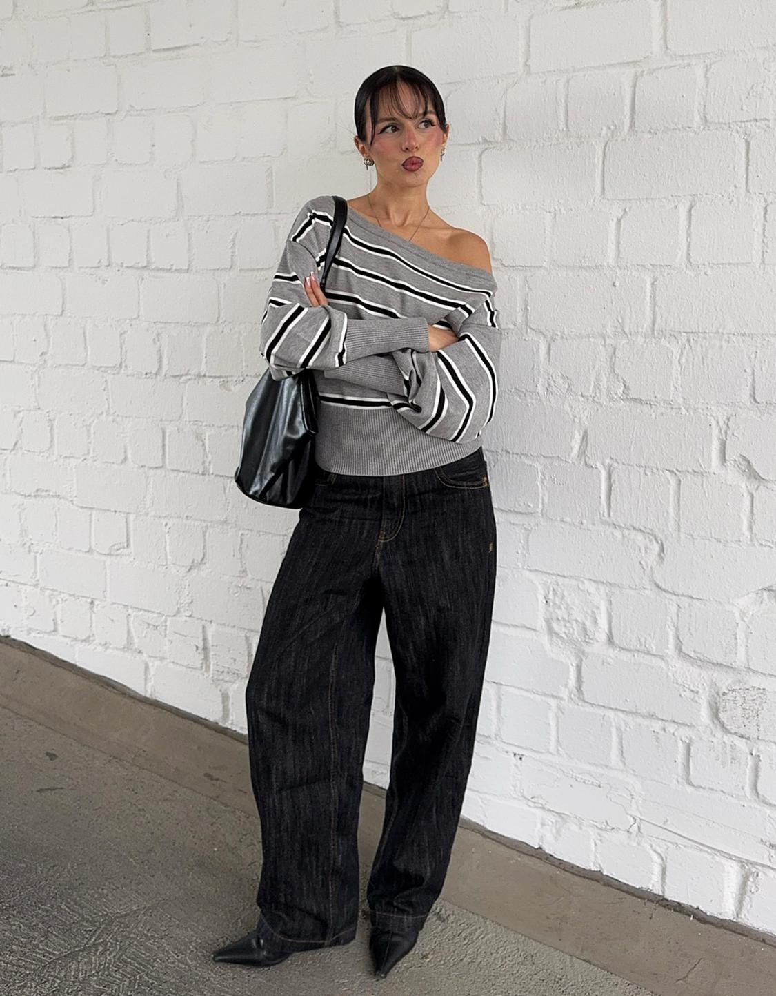 Asymmetric sweater with ribbed hem