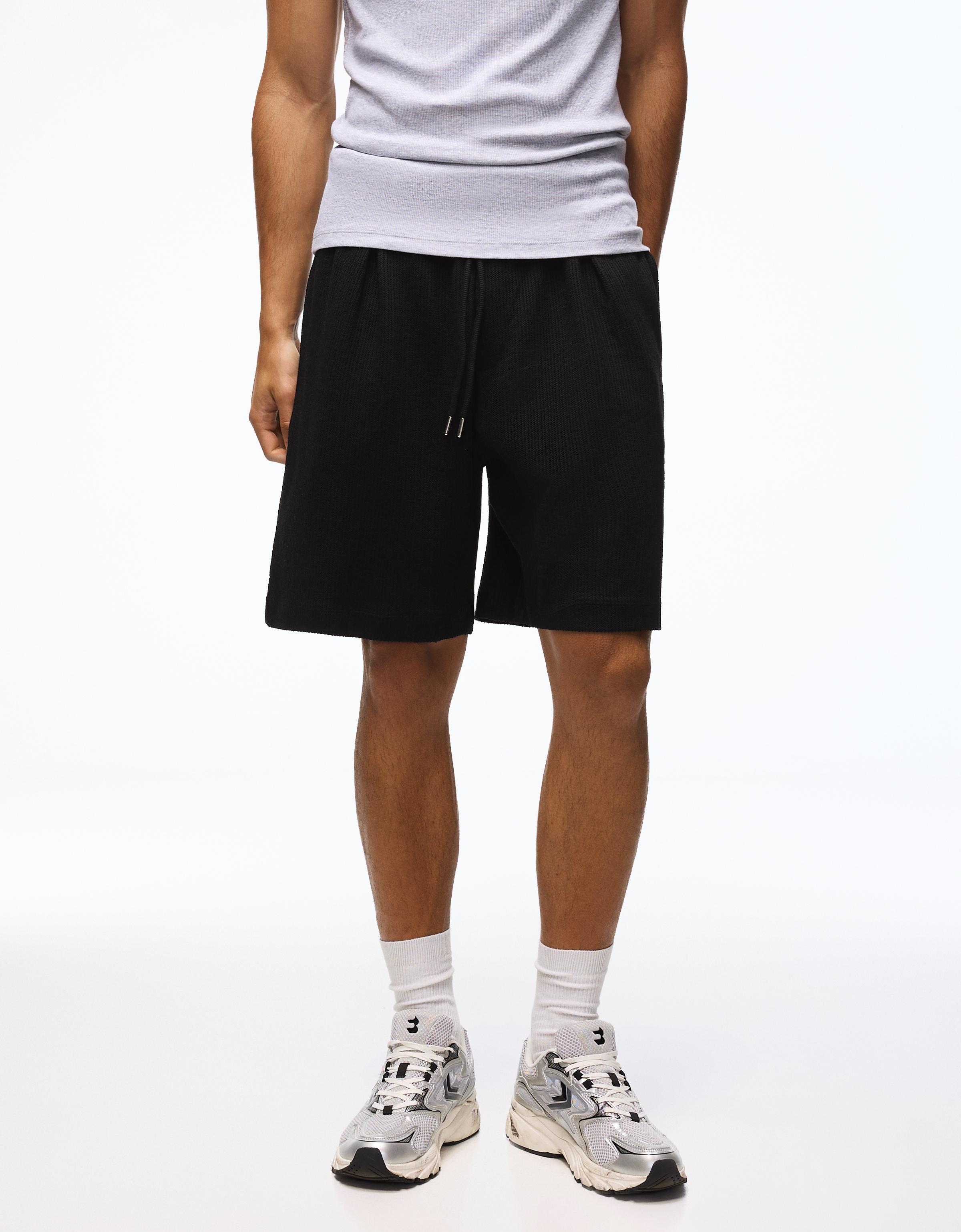 Textured plush Bermuda shorts — Black