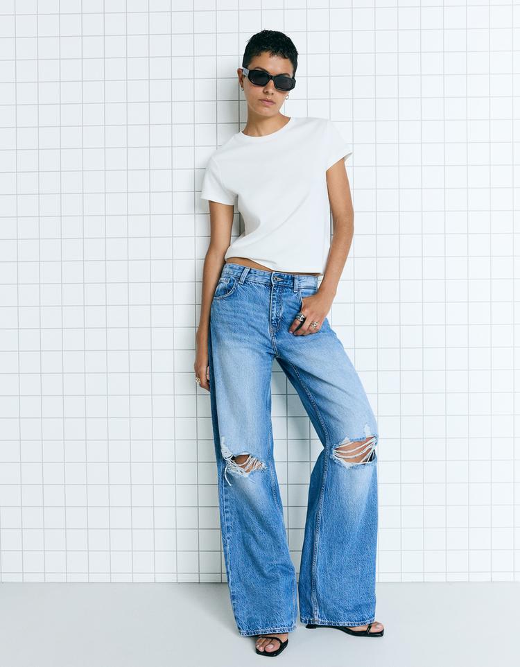 Jeans perna larga com rotos