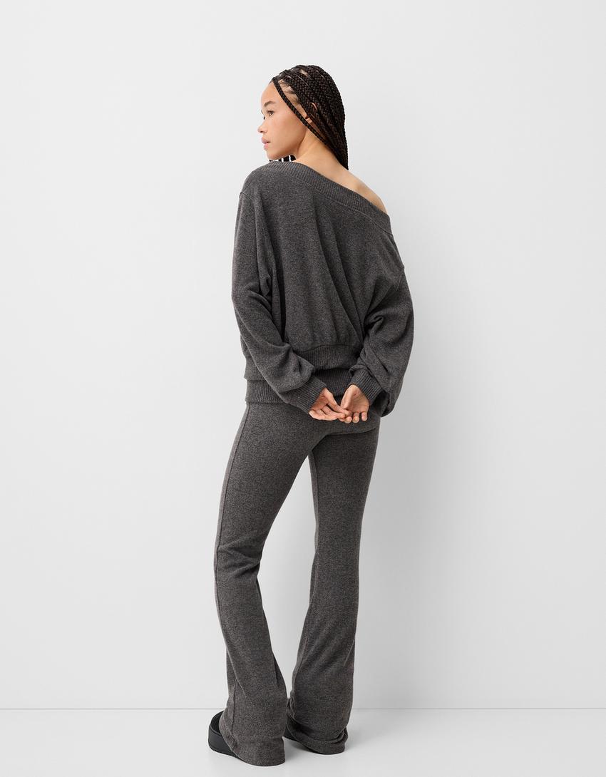 Flared trousers with fold-over waist