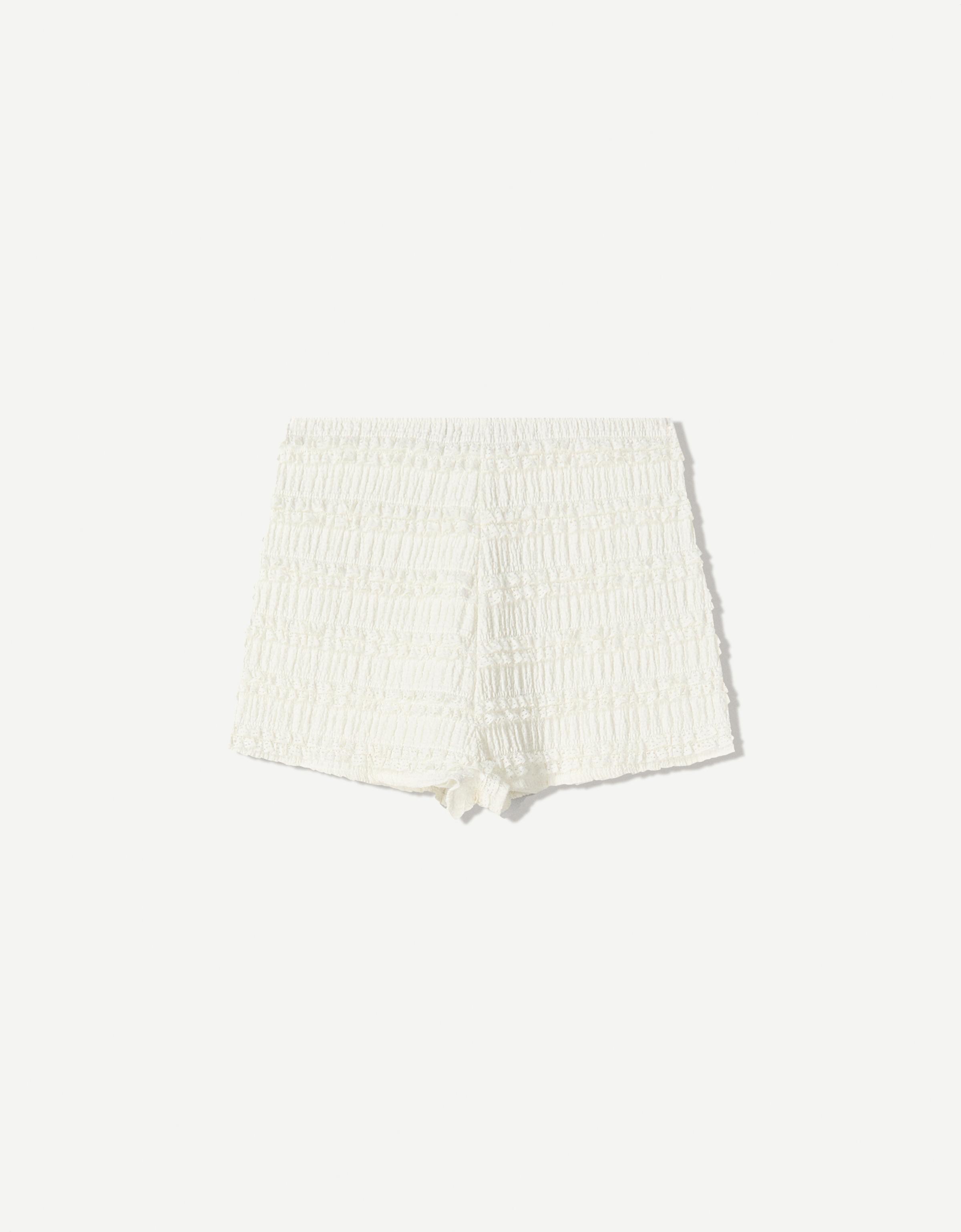 Textured waffle-knit shorts with ruffles - Shorts - Women
