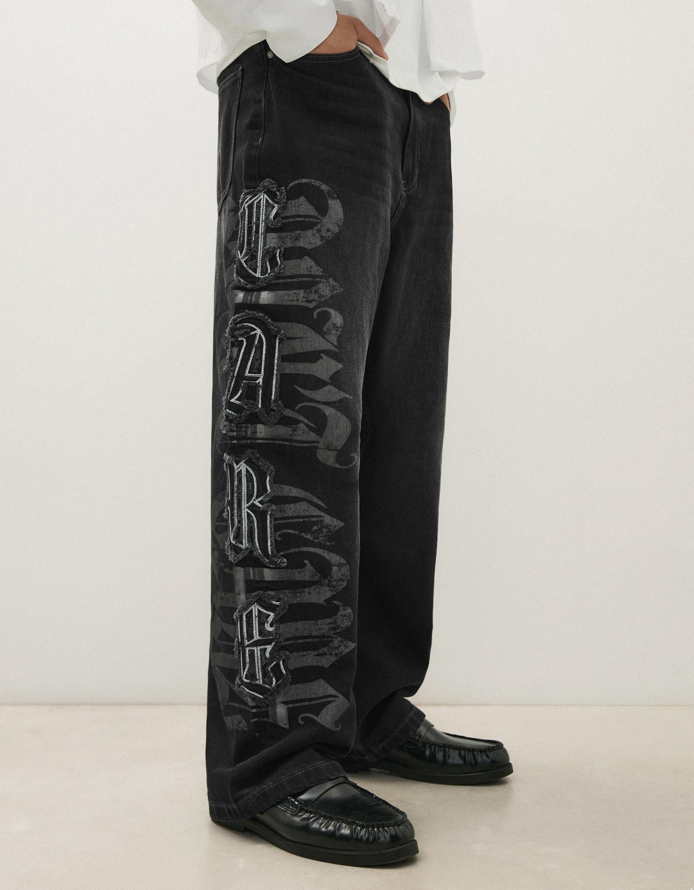 Baggy jeans with star patches — Black
