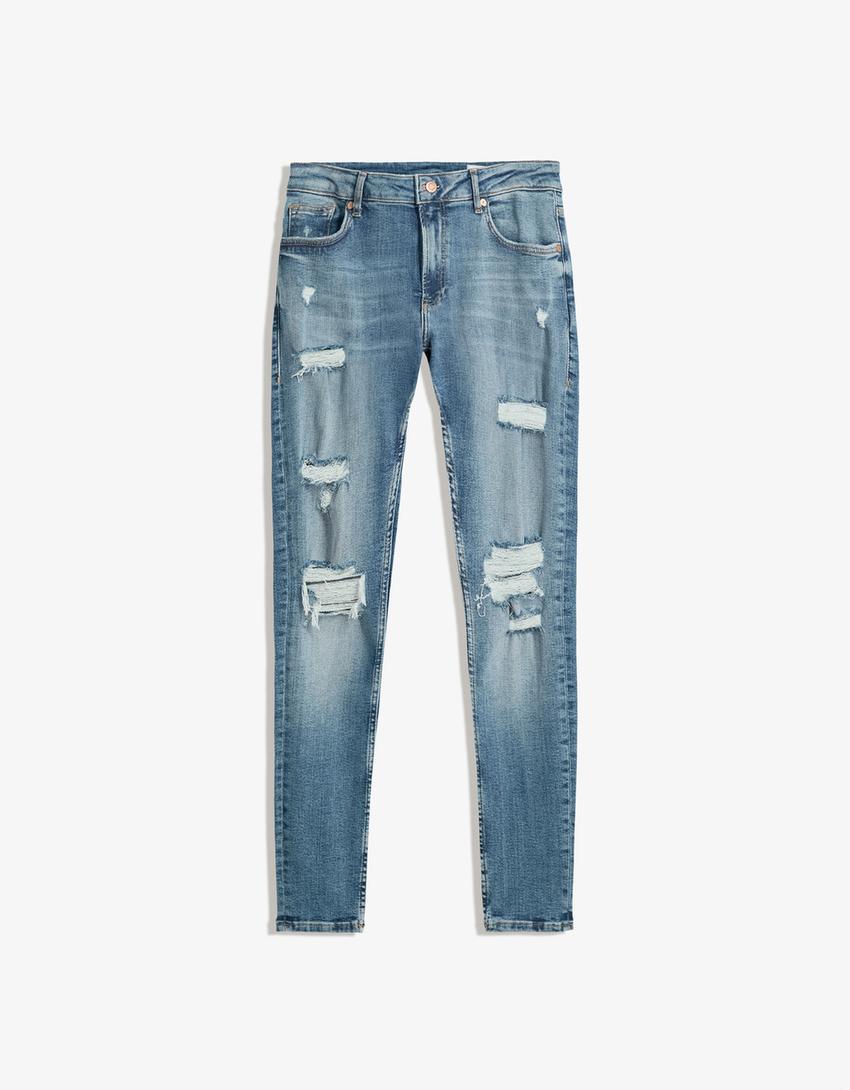 Jeans super skinny strappati-Azzurro Lavato