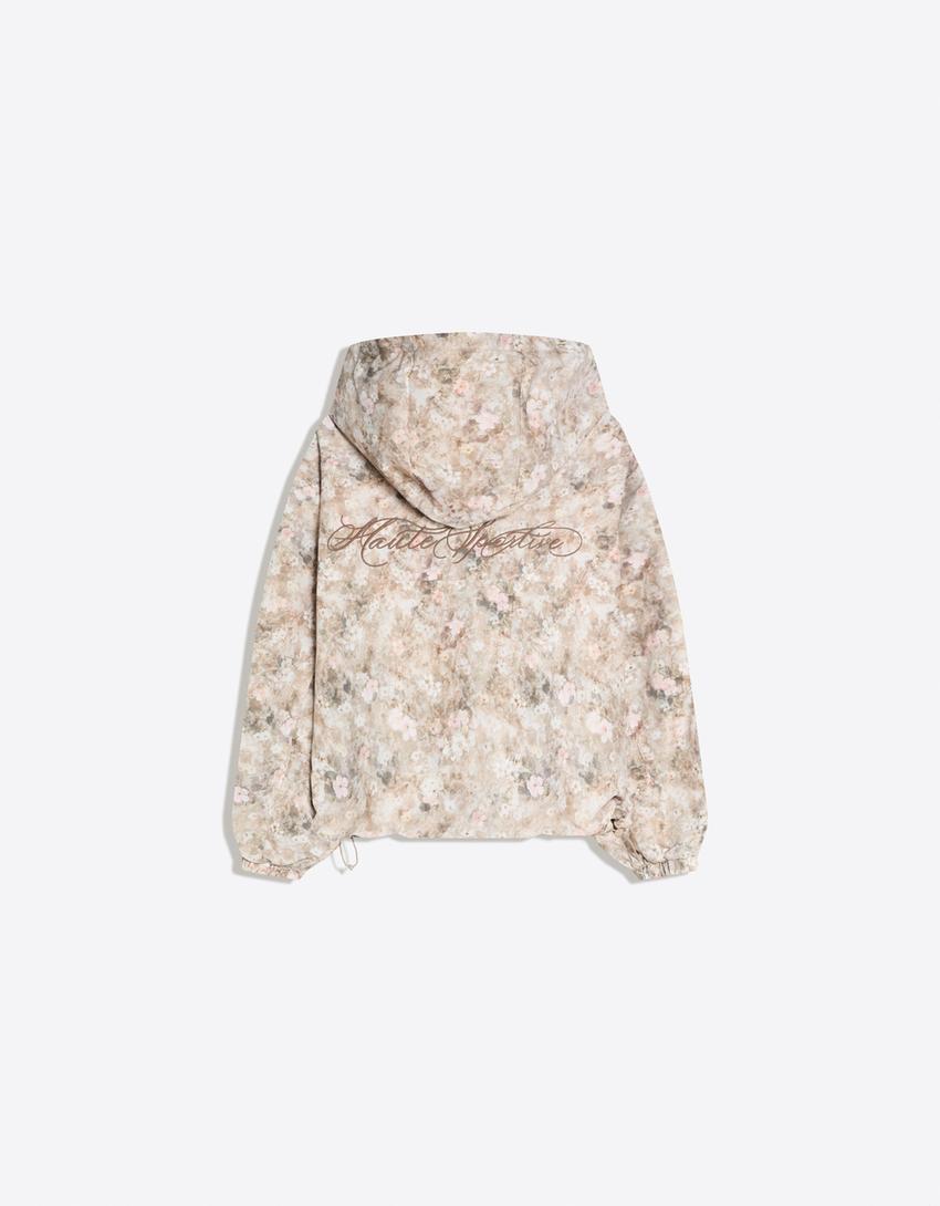 Wasserfeste und winddichte Jacke mit Kapuze und Print-Beige