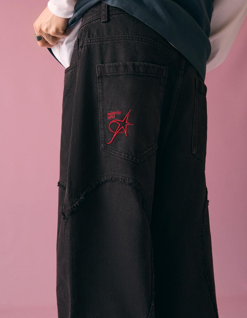 Pantaloni super baggy fit ricamati-Nero
