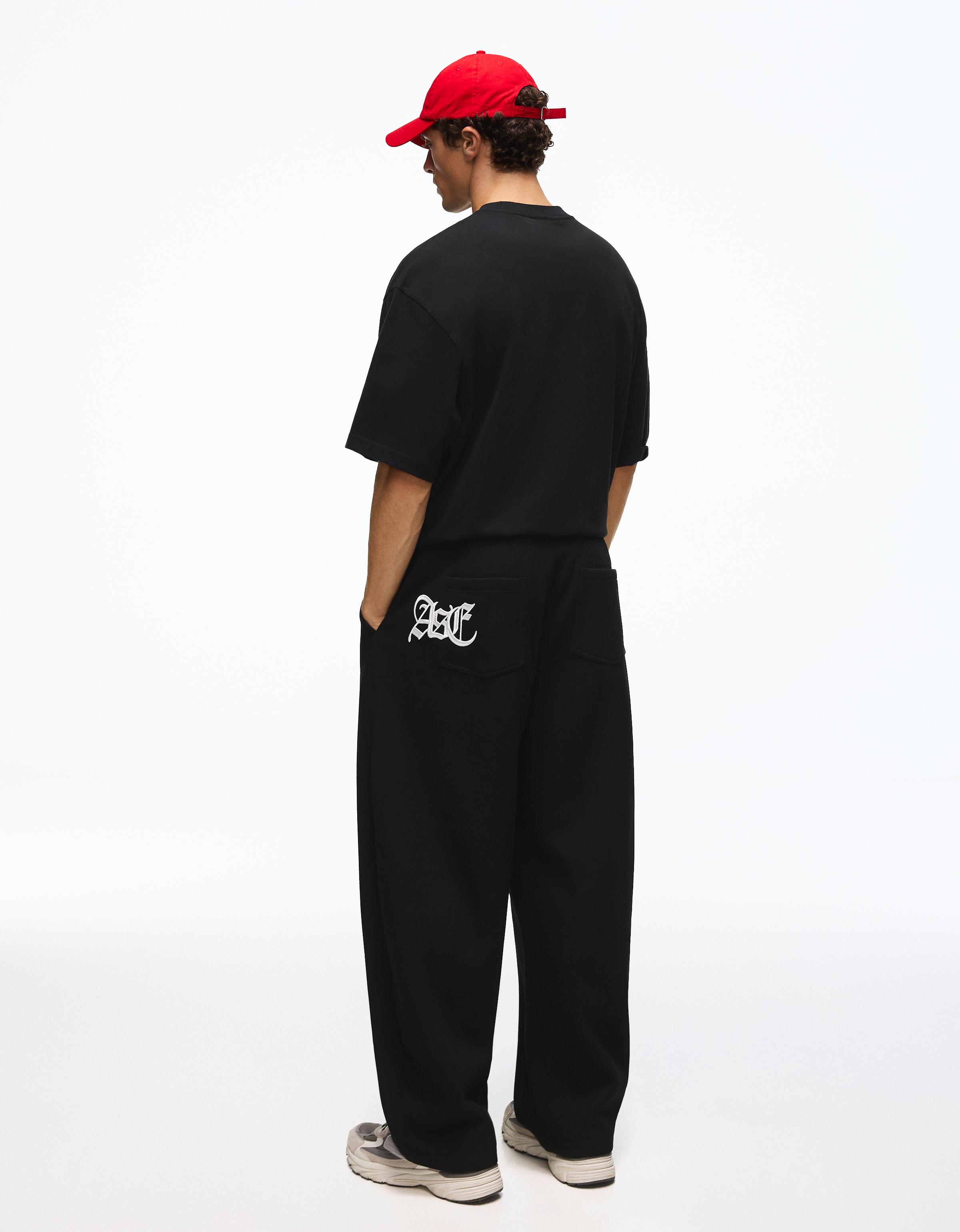 Embroidered waffle-knit balloon trousers — Black