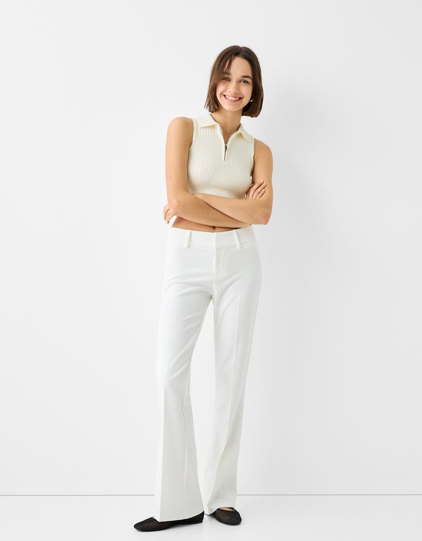 توب بدون أكمام وبسحّاب وياقة بولو-كريمي-3