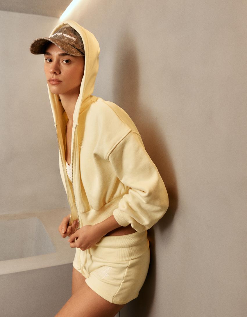 Plush Bermuda shorts with fold-over waist-Banana