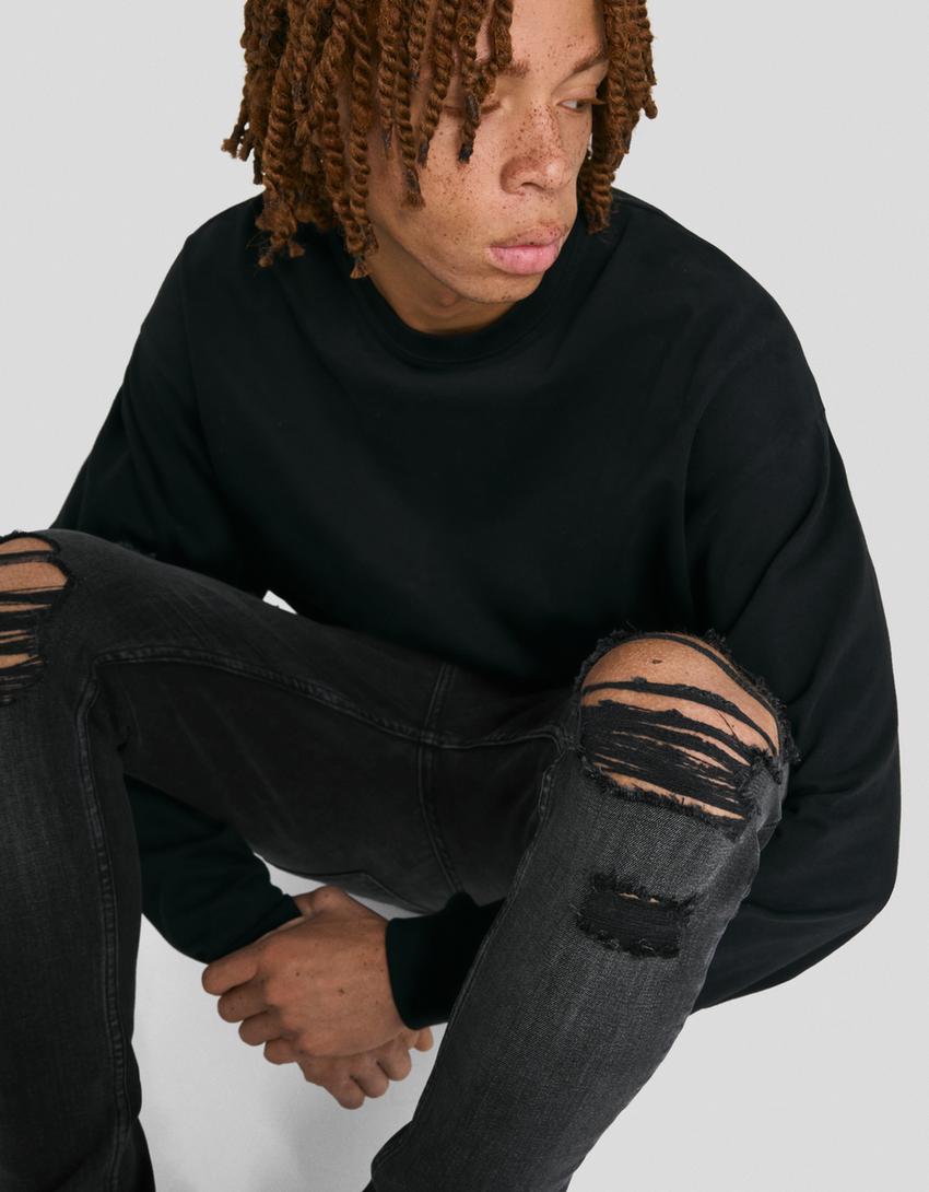 Jeans super skinny strappati-Nero